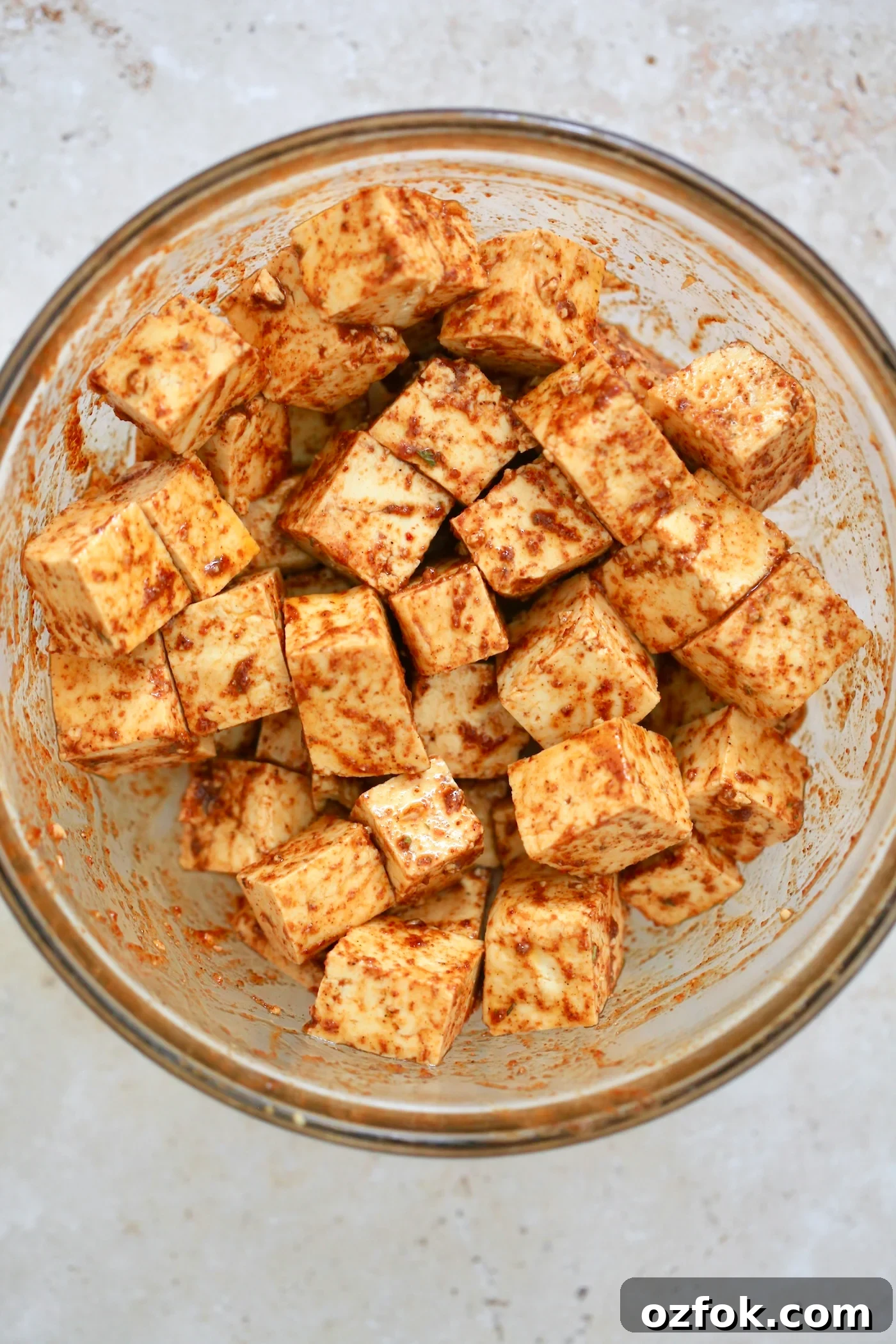 Flavor-Packed Baked Tofu Fajitas with Roasted Veggies 3 cubed brown tofu in mixing bowl