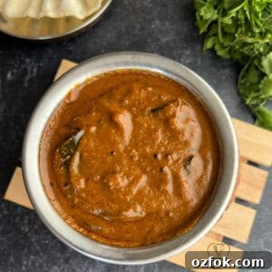 Coriander Leaf Kuzhambu (Kothamalli Kuzhambu) Recipe 2 Delicious traditional South Indian coriander leaves kuzhambu served in a bowl.