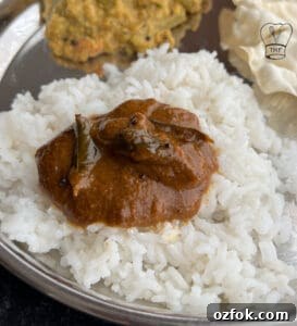 Coriander Leaf Kuzhambu (Kothamalli Kuzhambu) Recipe 3 Delicious coriander leaves kuzhambu served over fluffy white rice with traditional side dishes.