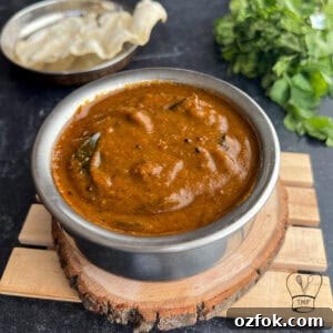 Coriander Leaf Kuzhambu (Kothamalli Kuzhambu) Recipe 4 Delicious Kothamalli Kuzhambu made with fresh coriander leaves, spices, and tamarind, served hot.