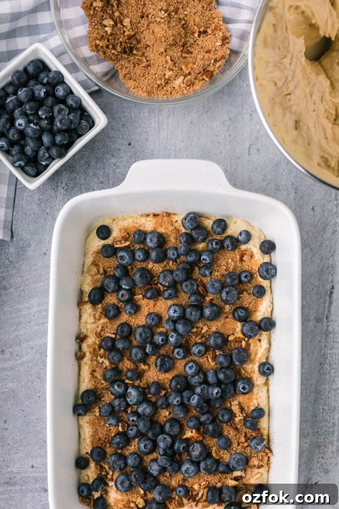 process photo of making homemade sour cream coffee cake with fresh blueberries.