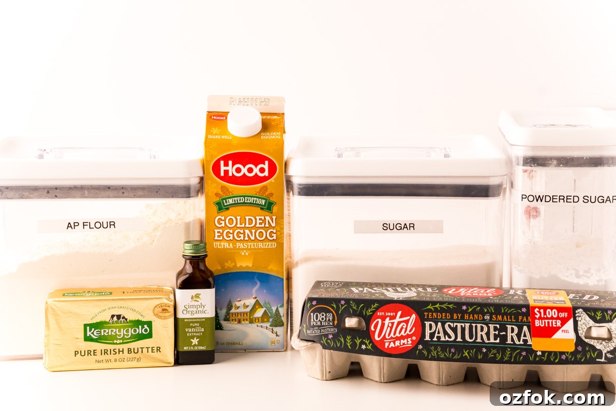 Ingredients to make eggnog cake on a white table.