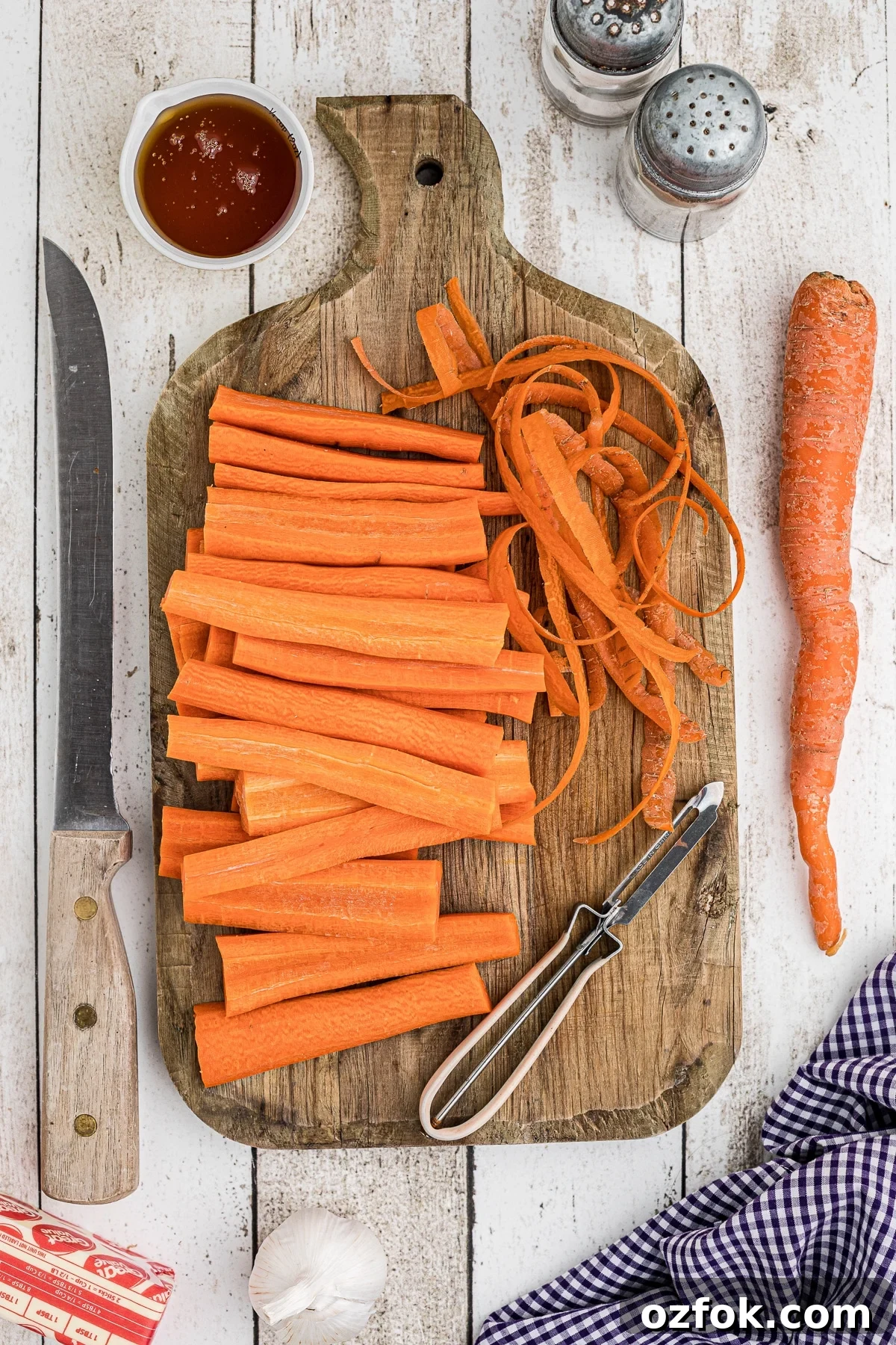 Carrots peeled on a cutting board.