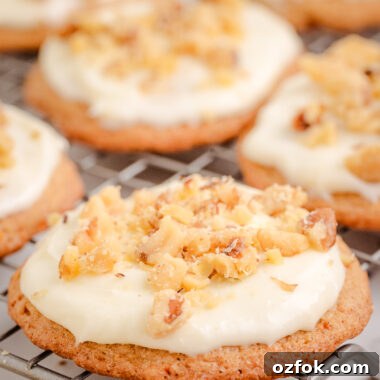 Soft Carrot Cake Cookies with Cream Cheese Frosting 5 Carrot Cake Cookies with cream cheese frosting on a cooling rack