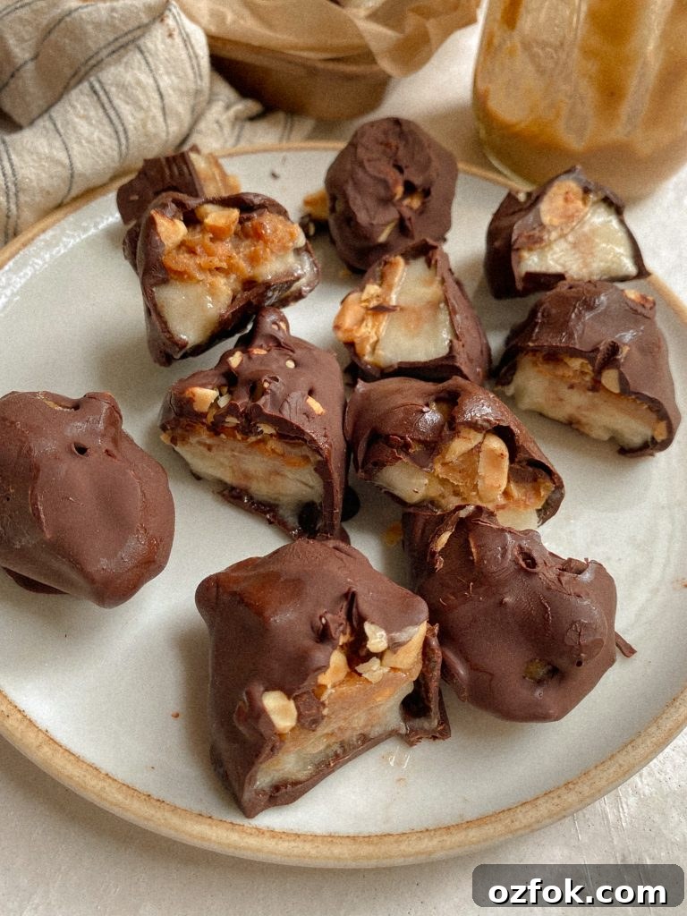 Vegan Gluten-Free Banana Snickers Bites Recipe 3 banana snickers bites on a plate with caramel and chocolate in the background