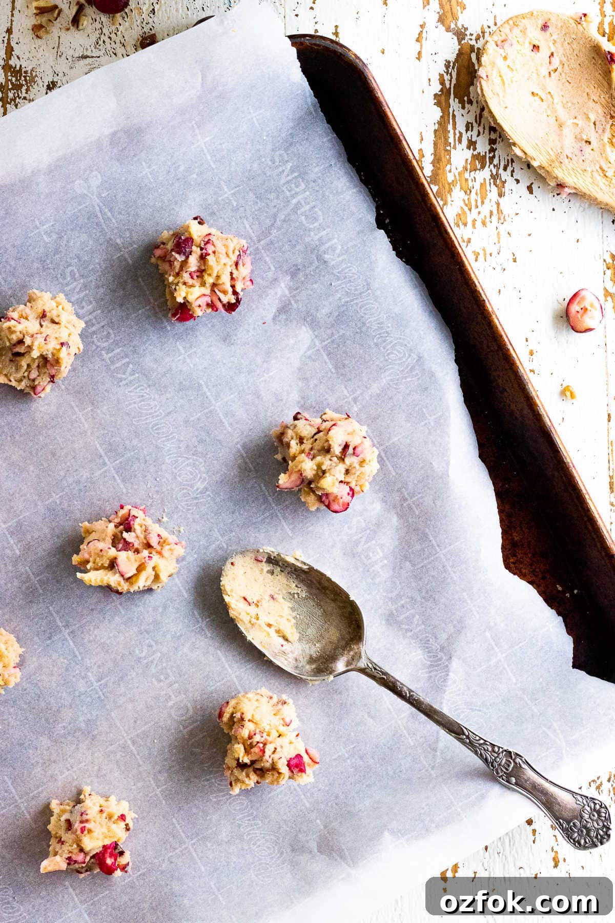 Cranberry Pecan Cookies with Old-Fashioned Flavor 6 Cookie dough on a cookie sheet.