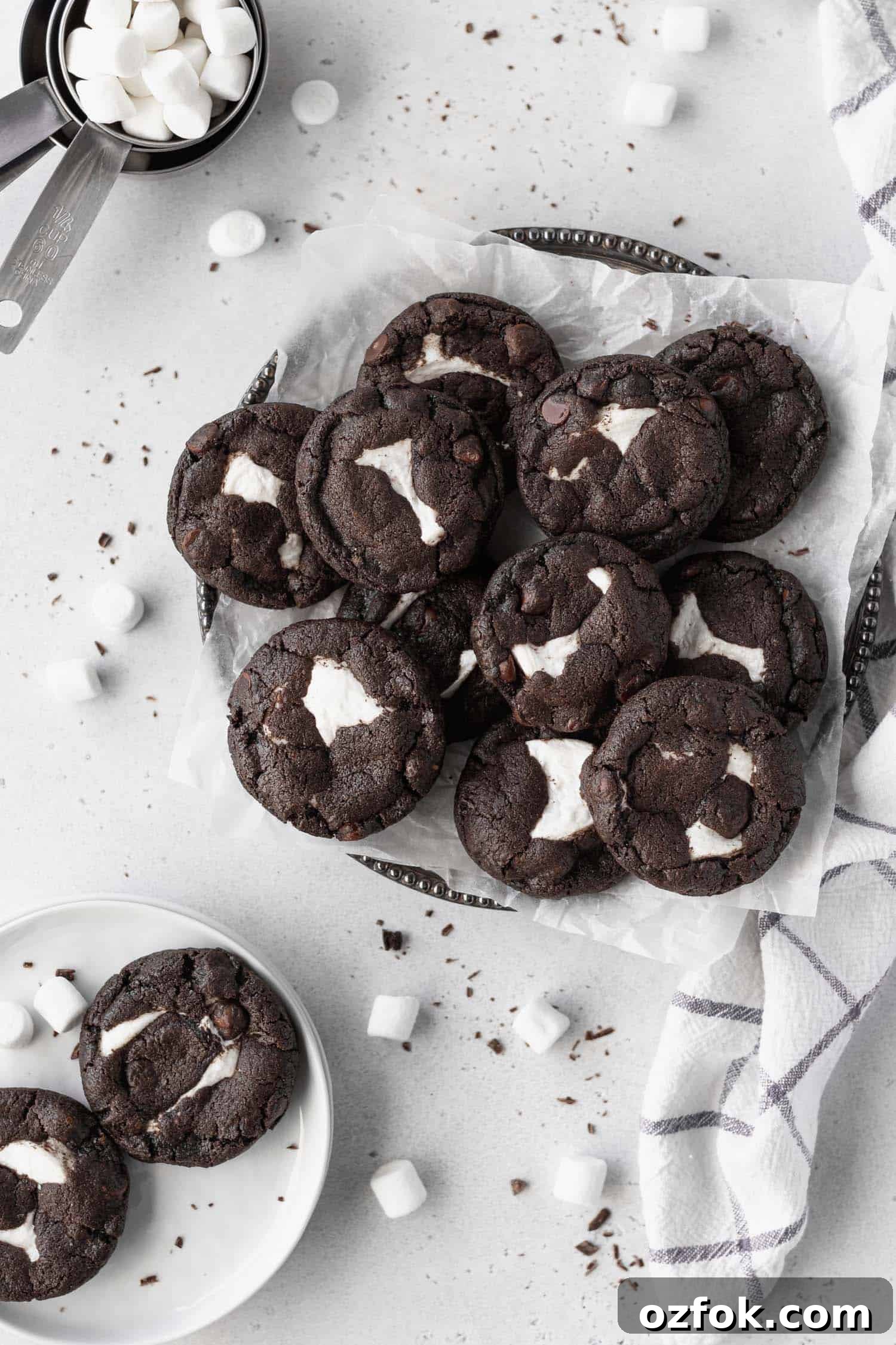 Gluten-Free Chocolate Cookies Stuffed with Gooey Marshmallows 2 Marshmallow stuffed chocolate cookies on a platter