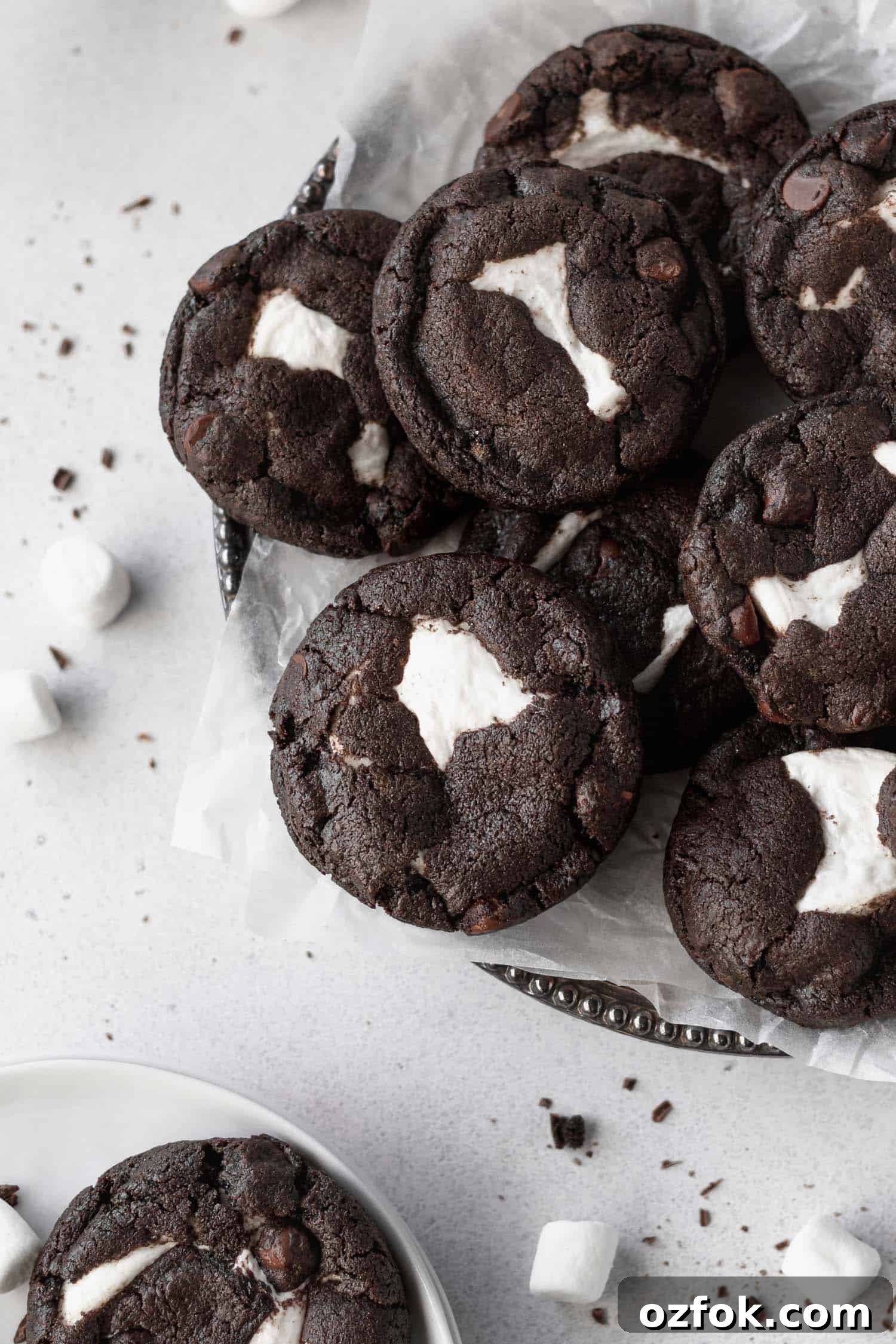 Gluten-Free Chocolate Cookies Stuffed with Gooey Marshmallows 3 Marshmallow stuffed chocolate cookies on a platter