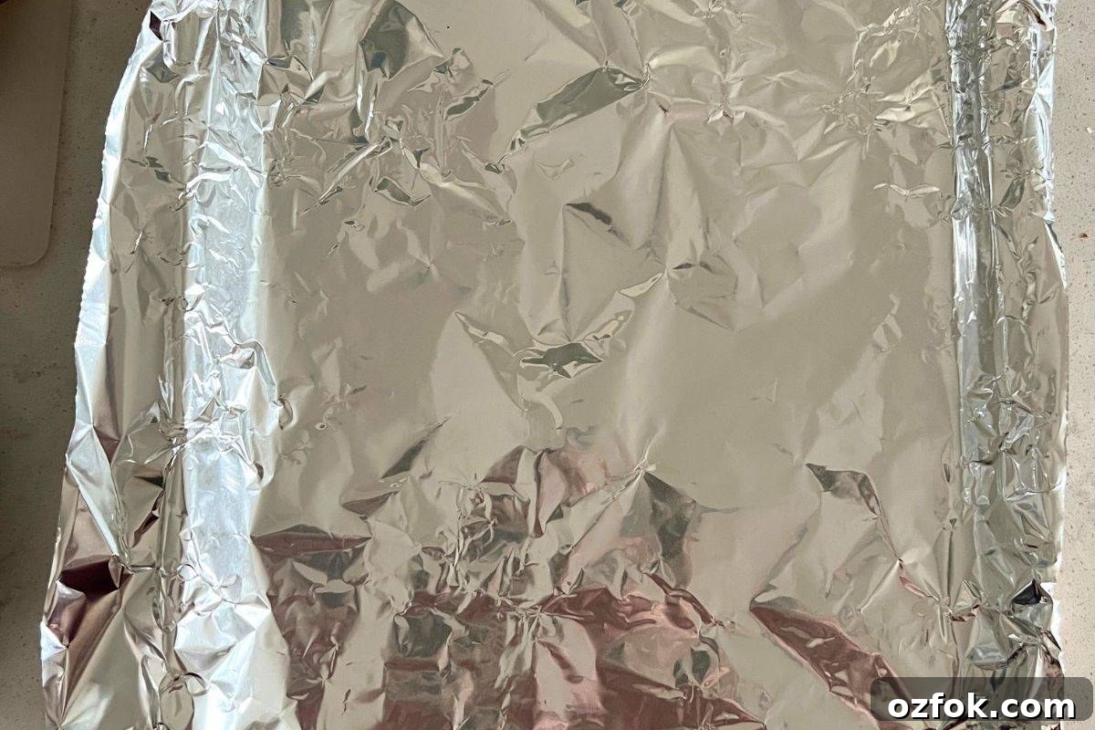 Smoked Sausage and Potatoes Skillet Recipe for Dinner 4 Baking sheet lined with tin foil.
