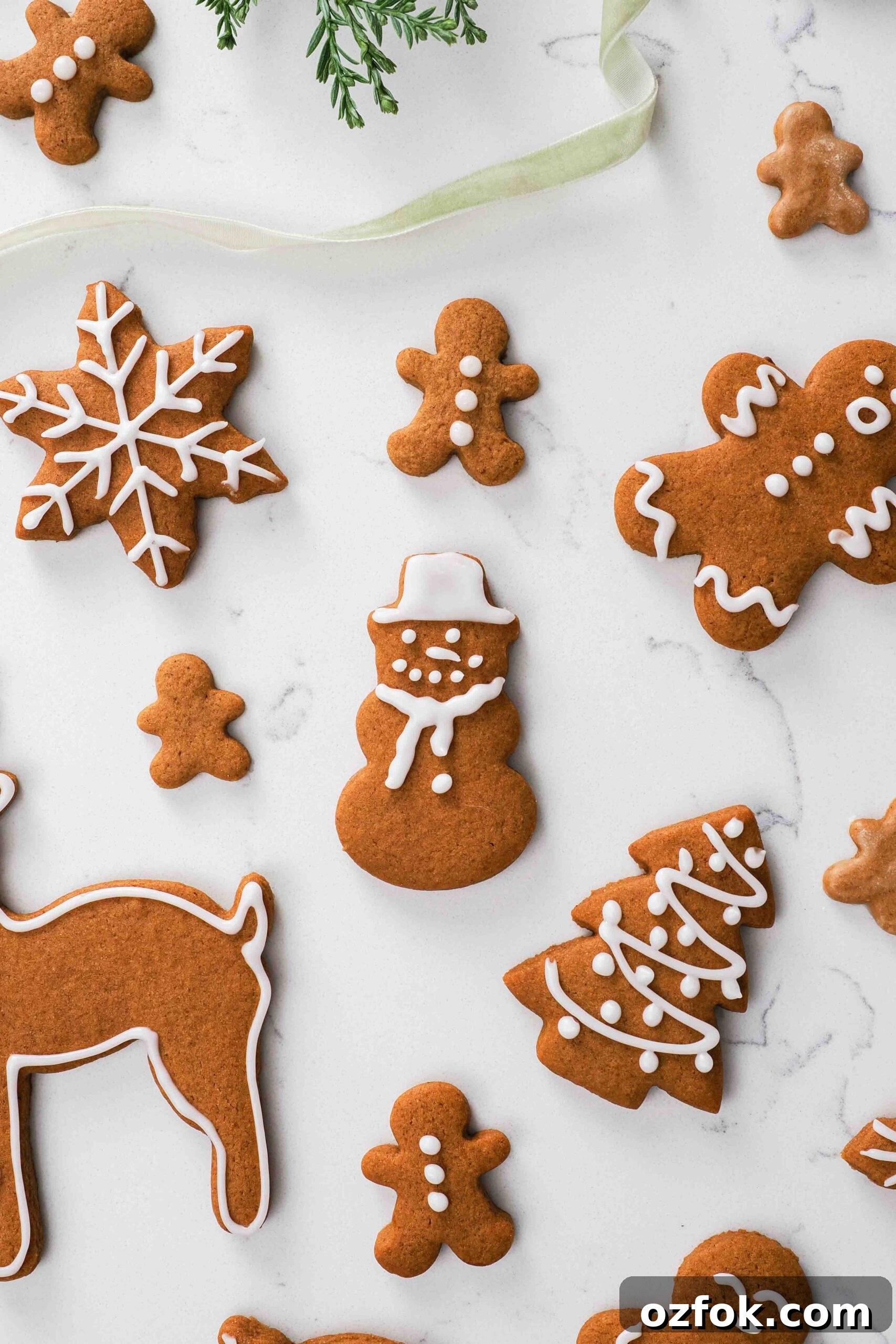 A gingerbread snowman amongst other gingerbread cookies.