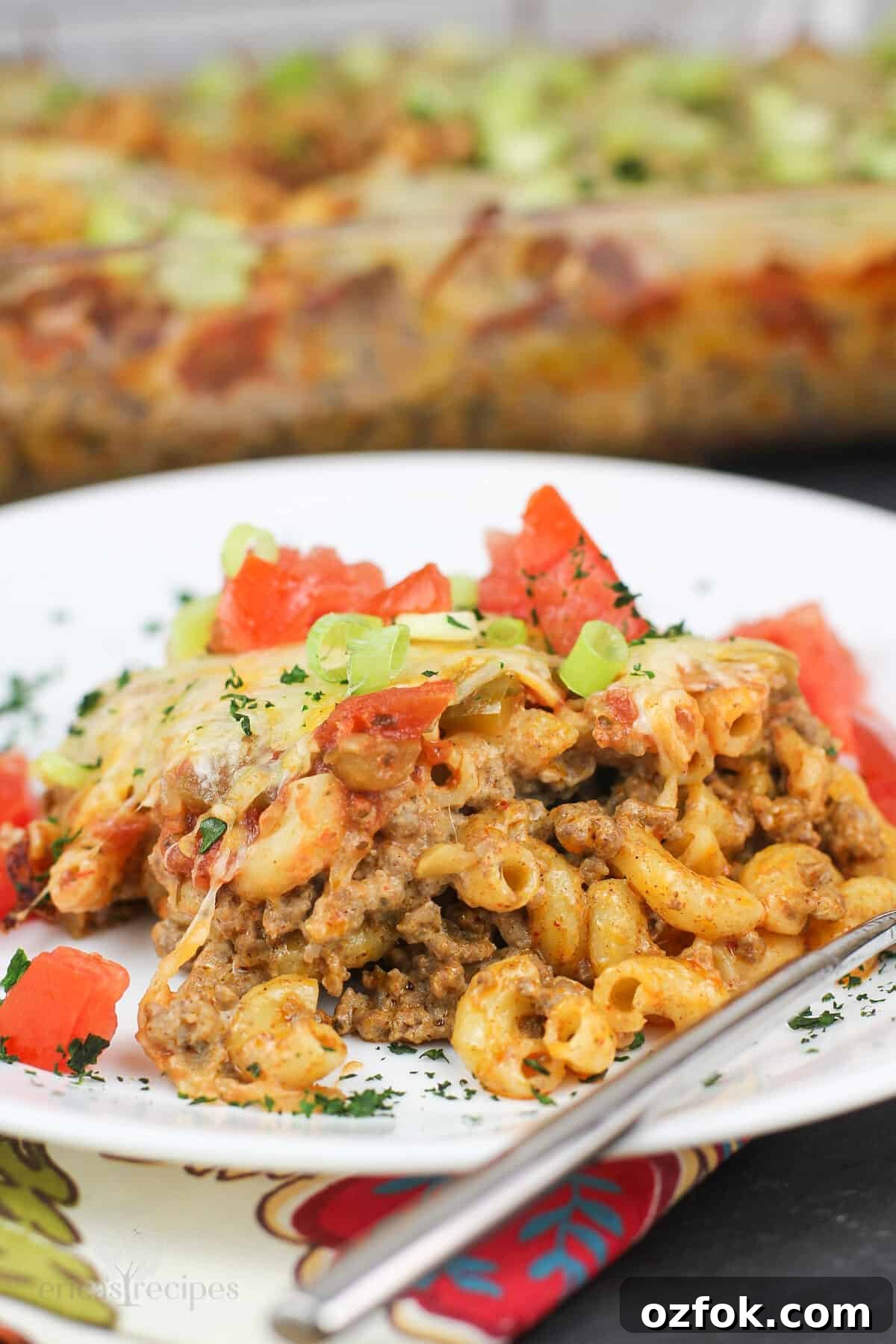 Taco Beef and Macaroni Casserole: Cheesy One-Pan Dinner 2 serving of taco bake on white dish