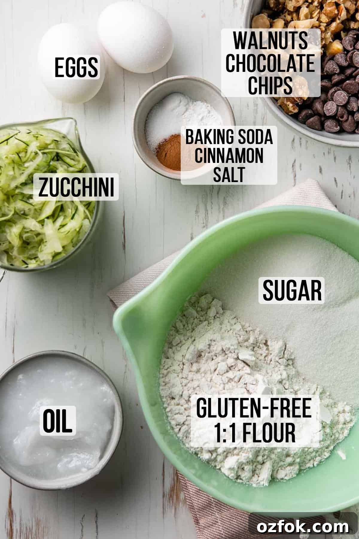 Gluten-Free Dairy-Free Zucchini Muffins Recipe 3 Gluten free flour, sugar, shredded zucchini, oil and remaining ingredients measured out in bowls.