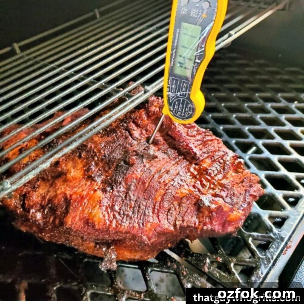 Brown Sugar Brisket Rub for Smoking: Sweet & Savory Blend 6 thermometer taking temperature of Beef Brisket smoking on a pit boss pellet grill