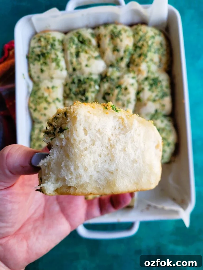 30-Min Garlic Parmesan Dinner Rolls Recipe 7 Close-up of buttery garlic rolls with melted parmesan and parsley
