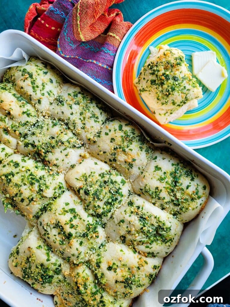 30-Min Garlic Parmesan Dinner Rolls Recipe 3 Golden garlic parmesan dinner rolls fresh out of the oven