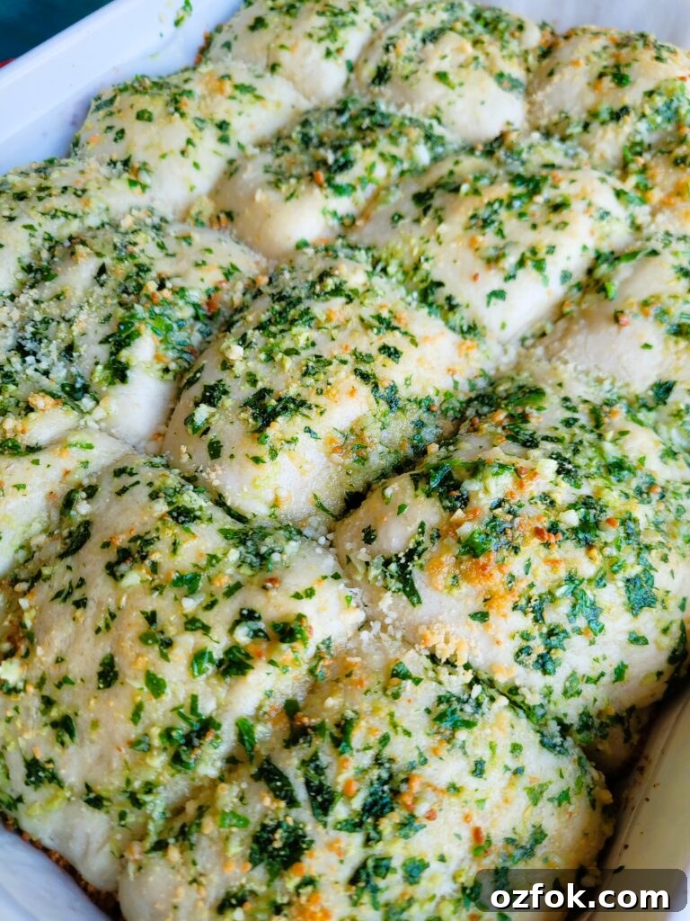 30-Min Garlic Parmesan Dinner Rolls Recipe 4 Finished garlic parmesan dinner rolls garnished with parsley