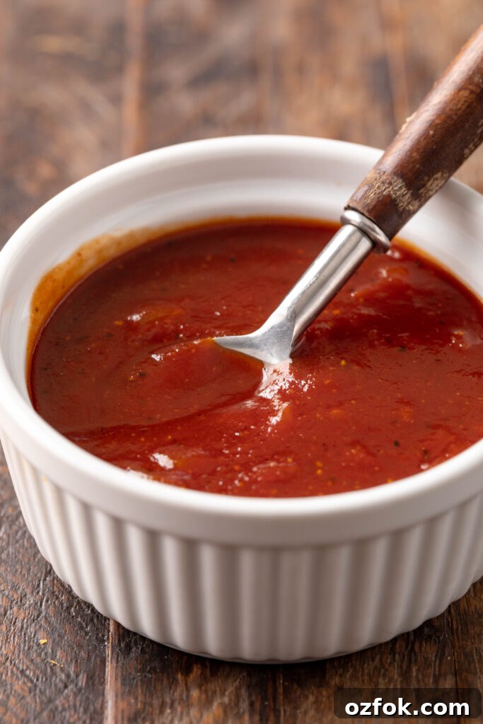 Sweet and Spicy Barbecue Sauce Recipe for Grilling and Dipping 5 bowl of sweet & spicy bbq sauce in a bowl with a spoon