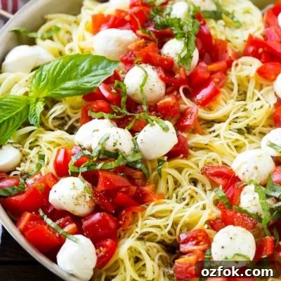 Caprese Pasta Salad with Fresh Tomatoes, Basil & Mozzarella 2 Caprese pasta with fresh diced tomatoes, mozzarella balls and thinly sliced basil.