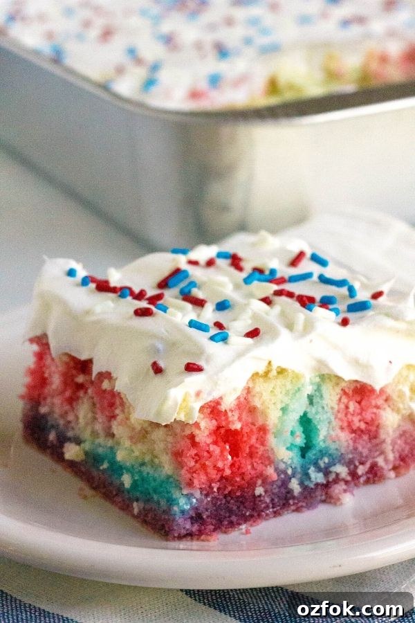 Patriotic Red White & Blue Poke Cake Recipe for 4th of July 3 piece of patriotic poke cake in front of the pan that it baked in