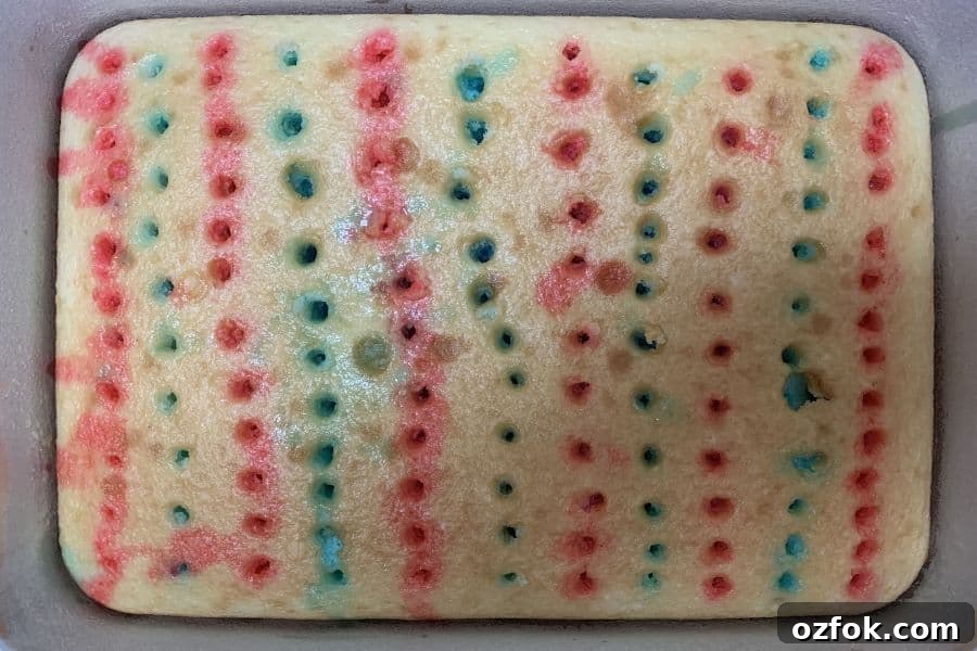 Patriotic Red White & Blue Poke Cake Recipe for 4th of July 8 Alternating rows of blue and red Jello in the holes of a poke cake.