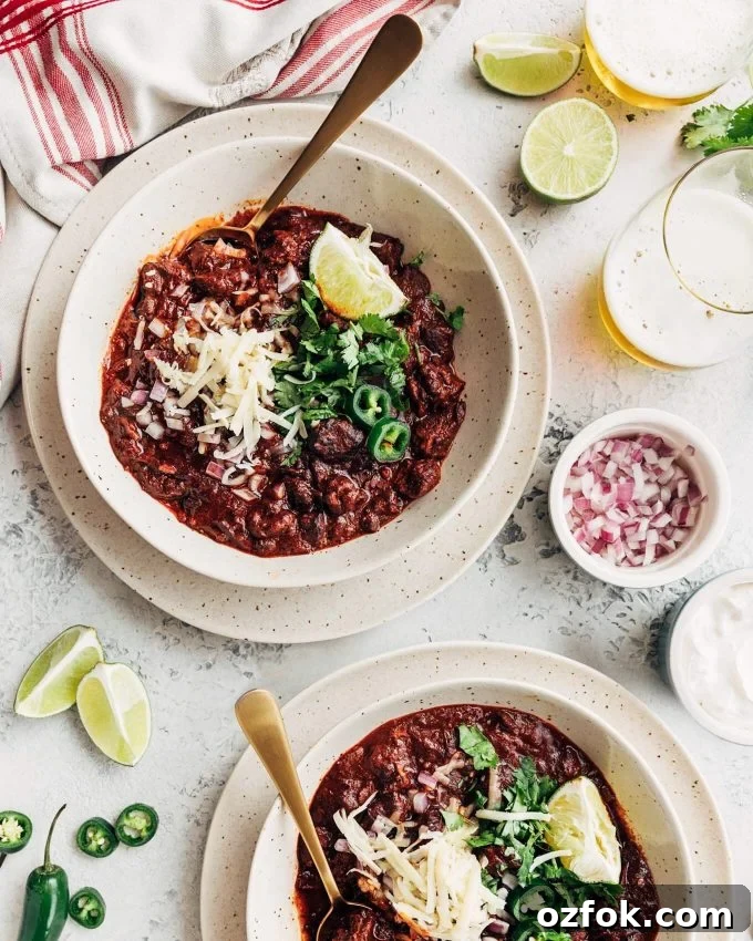 Texas-Style Instant Pot Chili Recipe: Quick, Hearty Weeknight Meal 5 Instant Pot Chili Con Carne served with cheese, onion, lime, and sour cream