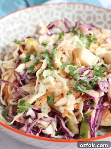 Apple coleslaw in a serving bowl.