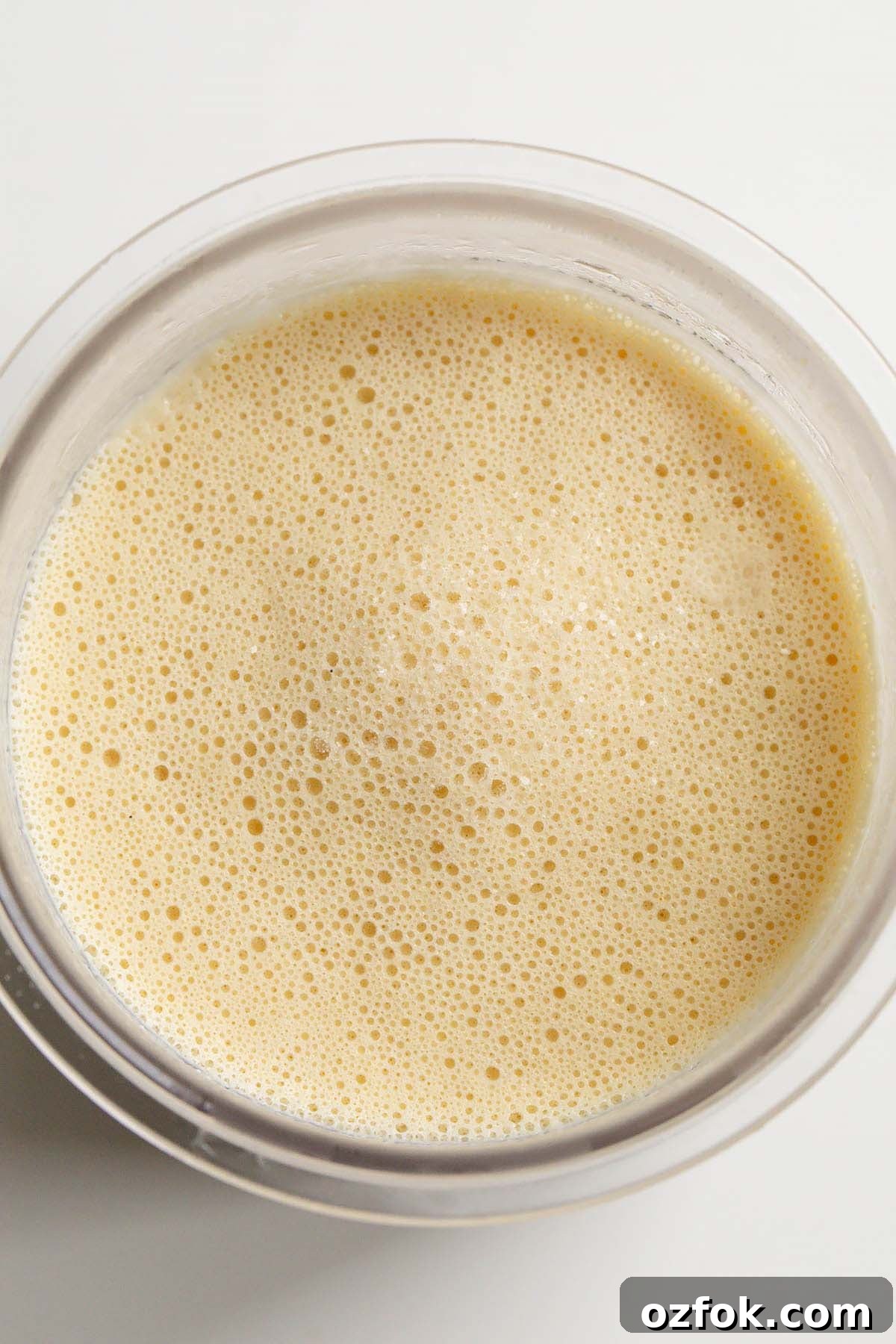 Frozen peanut butter ice cream in Creami container