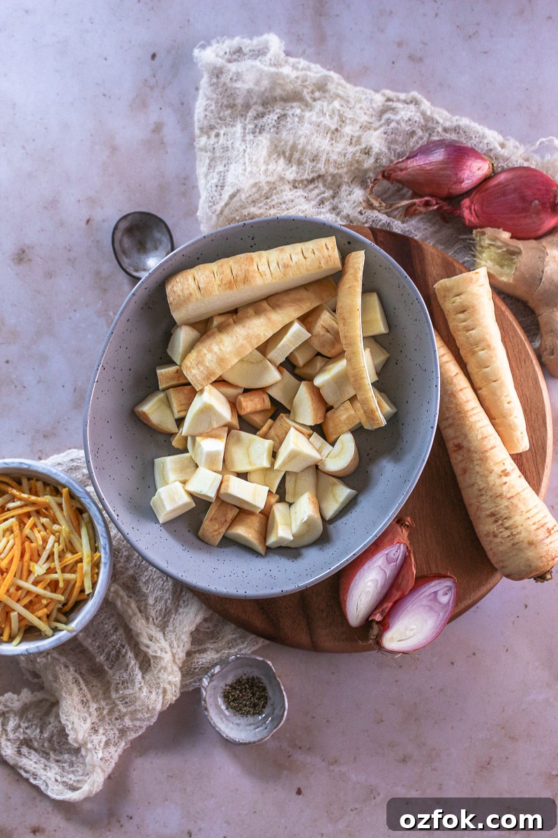 The ingredients for leek and parsnip soup on a flat surface.