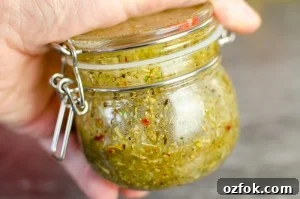 Shaking the Italian salad dressing together in a glass pot