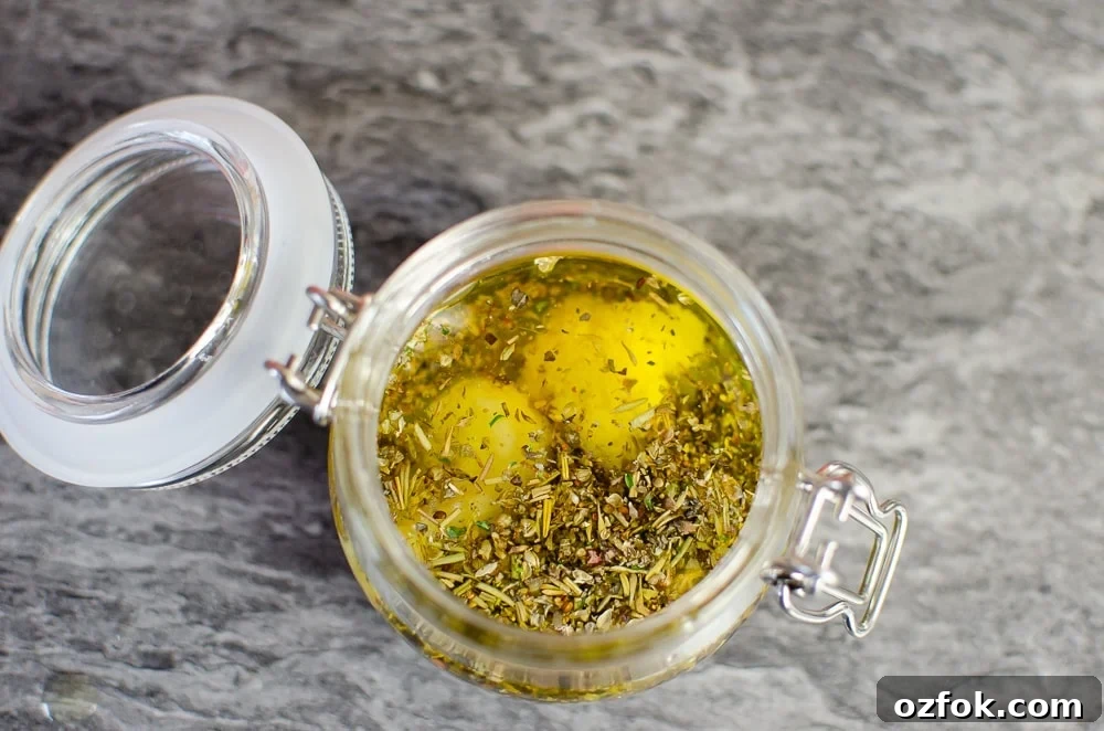 Crushed garlic has been added to our Mediterranean salad dressing in a glass pot