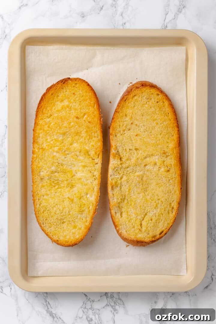 Overhead view of two toasted French bread loaf halves