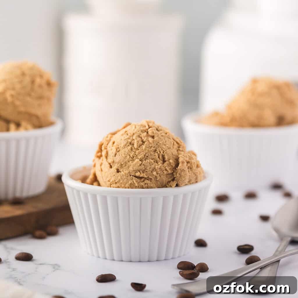 Scoops of coffee ice cream in white dishes.