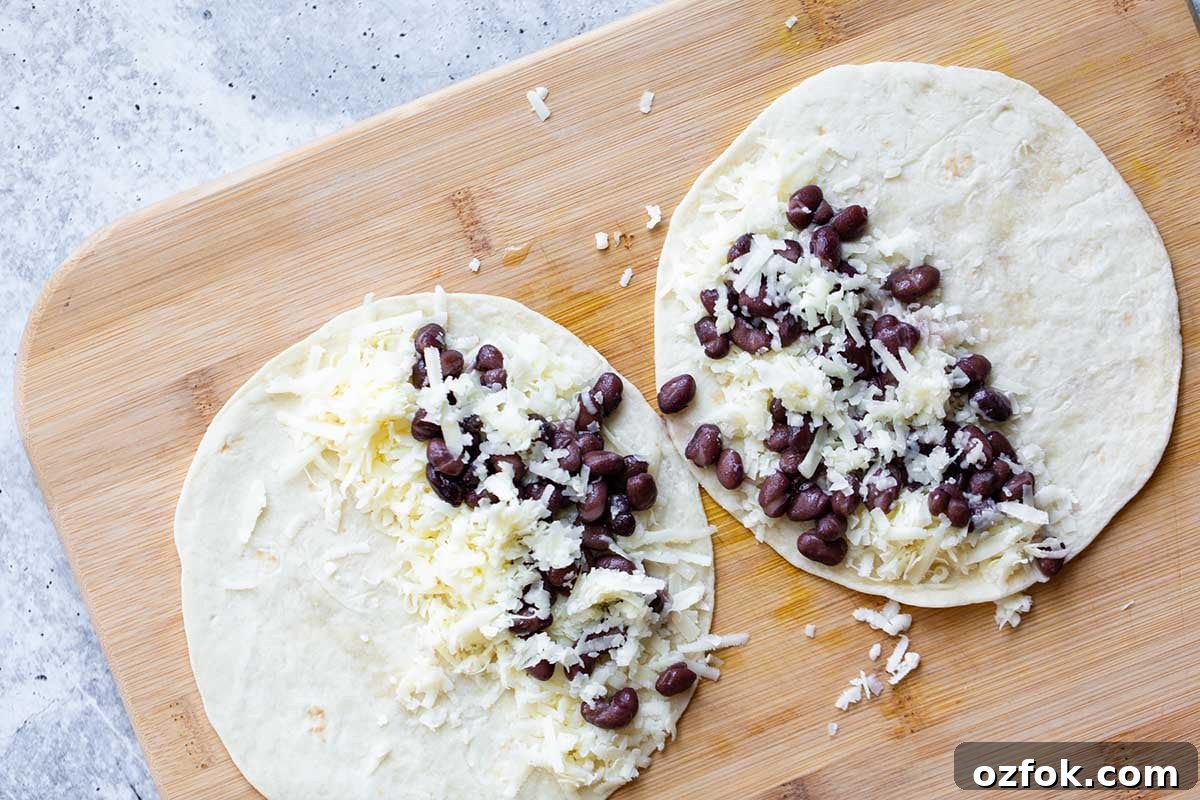 preparing quesadillas with cheese and beans